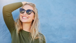 Young woman smiling after Zoom teeth whitening at Russo Dentistry Raleigh, NC.