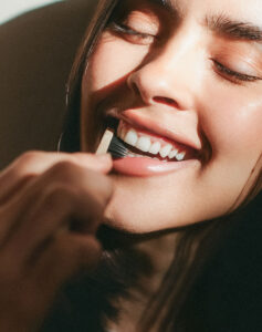 Smiling patient holding a toothbrush